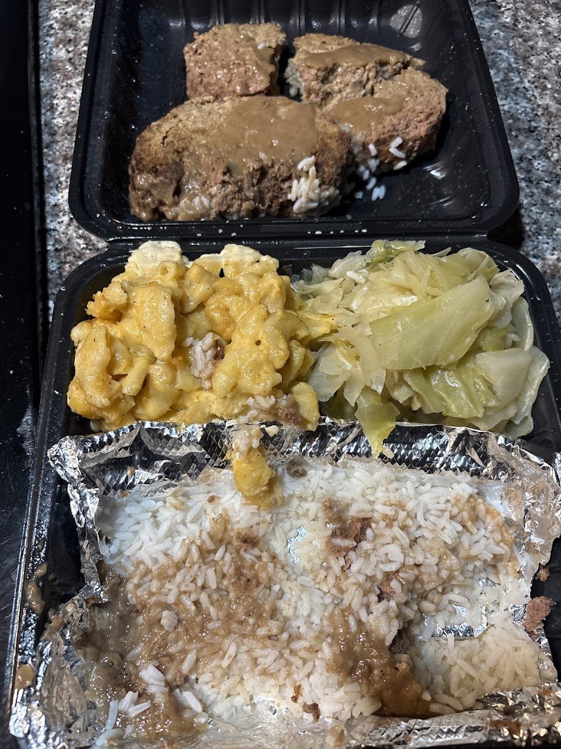 Golden fried chicken beside creamy sides.